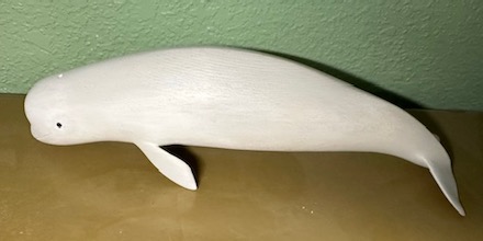 Beluga: Hand-carved wood sculpture by Frank Keim