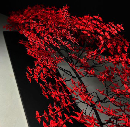 Tree sculpture with leaves of red origami cranes by Naoki Onogawa