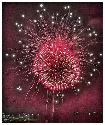 Photograph of red fireworks by Alexis Rhone Fancher