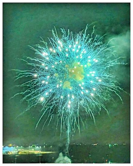 Photograph of green-blue fireworks by Alexis Rhone Fancher