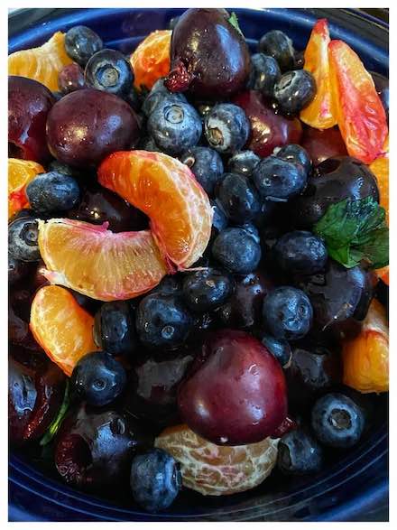 Photograph of fruits on Plate by Alexis Rhone Fancher